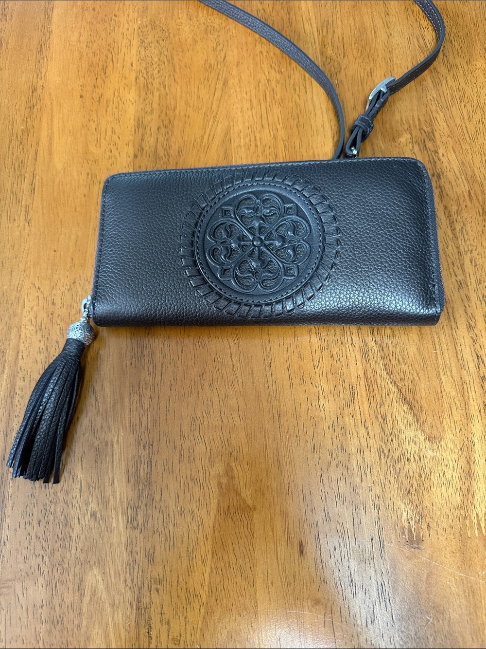 Brighton vintage brown shimmer leather wallet with adjustable strap.